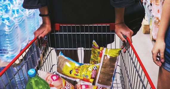 Person pushing grocery cart